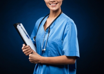 Happy lady doctor in blue uniform and with stethoscope wih folder looking camera isolated