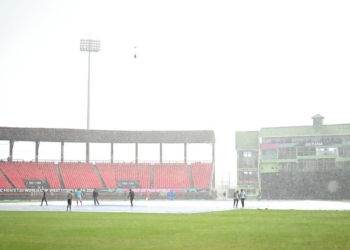 GEORGETOWN, GUYANA - JUNE 27: General view as rain falls on the pitch as ground staff work on the covers prior to the ICC Men's T20 Cricket World Cup West Indies & USA 2024 Semi-Final match between India and England at Providence Stadium on June 27, 2024 in Georgetown, Guyana. (Photo by Alex Davidson-ICC/ICC via Getty Images)